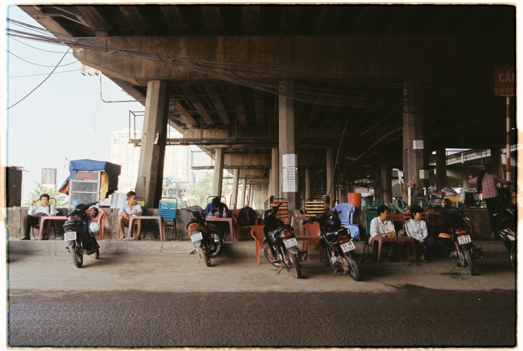 Construction workers take a coffee break under the new underground line running through the city, Dien Bien Phu, Binh Thanh, HCMC